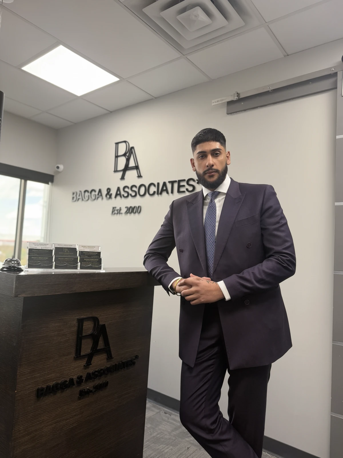 Rohan Bagga standing at the Bagga & Associates reception